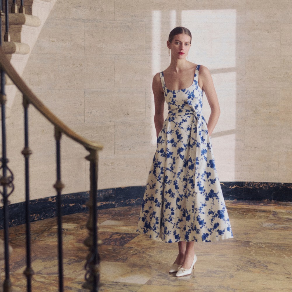 Woman in flower dress in lobby
