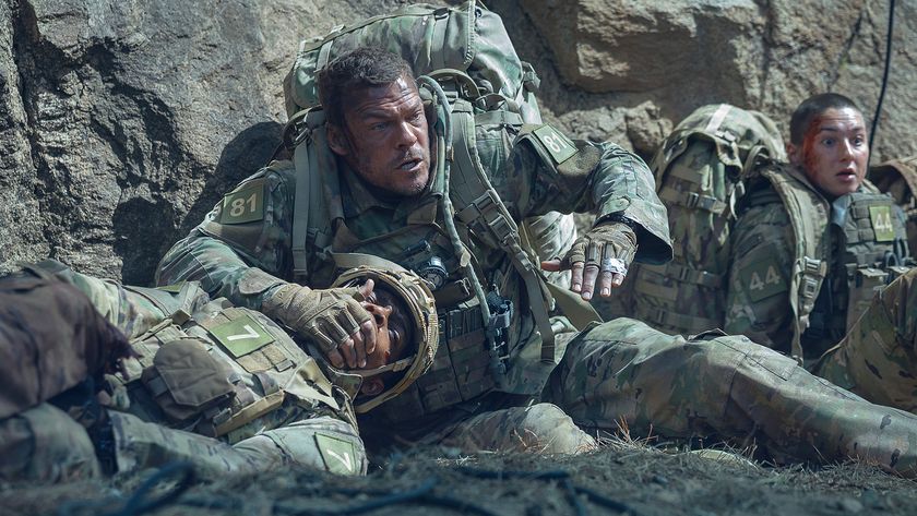 Three US Army personnel taking cover in Netflix's War Machine movie