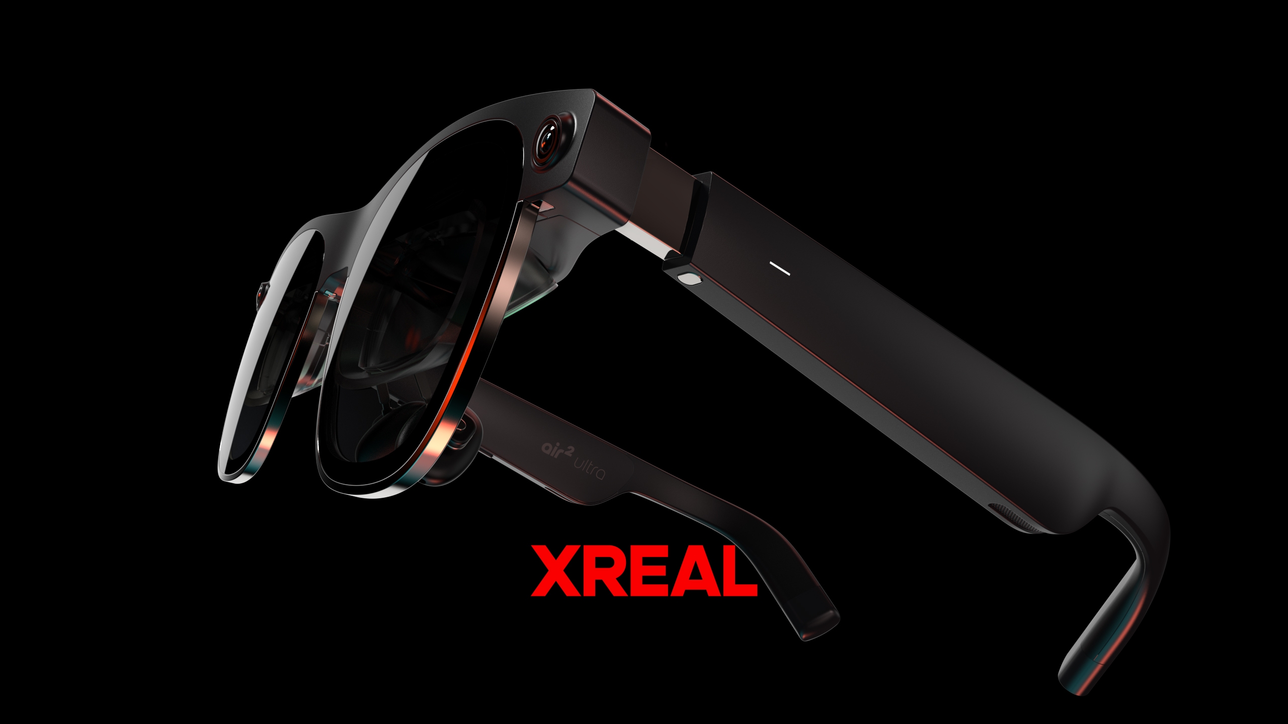 The Xreal Air 2 Ultra floating in front of a black background wqith the word 'Xreal' below them in red