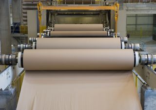 paper on rollers at a paper mill