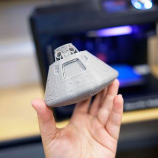 A 3D printed model of the Apollo 11 command module "Columbia" produced from a detailed scan of the spacecraft.