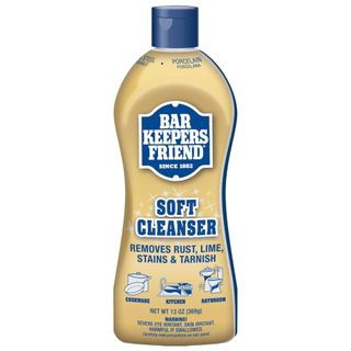 A yellow bottle of Bar Keepers Friend Soft Cleanser with blue label and blue lid