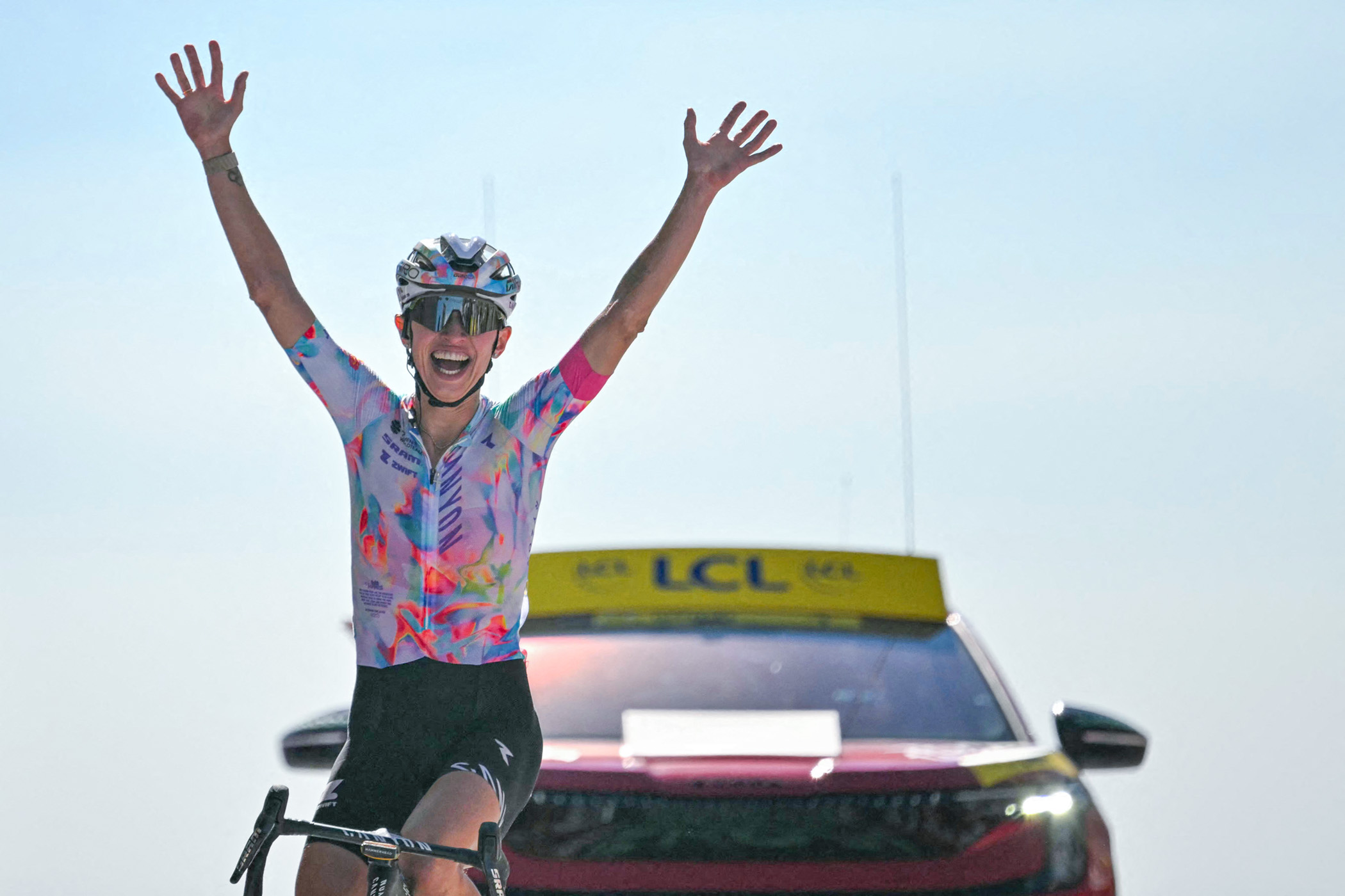 Canyon//SRAM zondacrypto's Polish rider Katarzyna Niewiadoma celebrates as she crosses the finish line to win the 7th (out of 9) stage of the fifth edition of the Women's Tour de France cycling race, 146.8 km from Voulte-sur-Rhone to The Mont Ventoux, at The Mont Ventoux, southeastern France on August 7, 2026. (Photo by NICOLAS TUCAT / AFP via Getty Images)