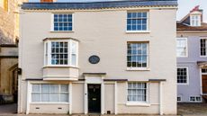 White brick house with white sash windows