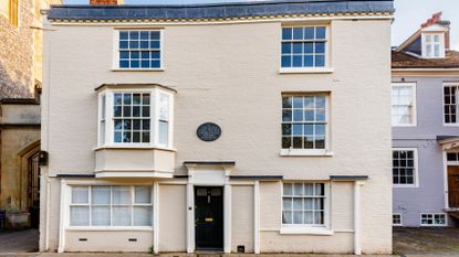 White brick house with white sash windows 