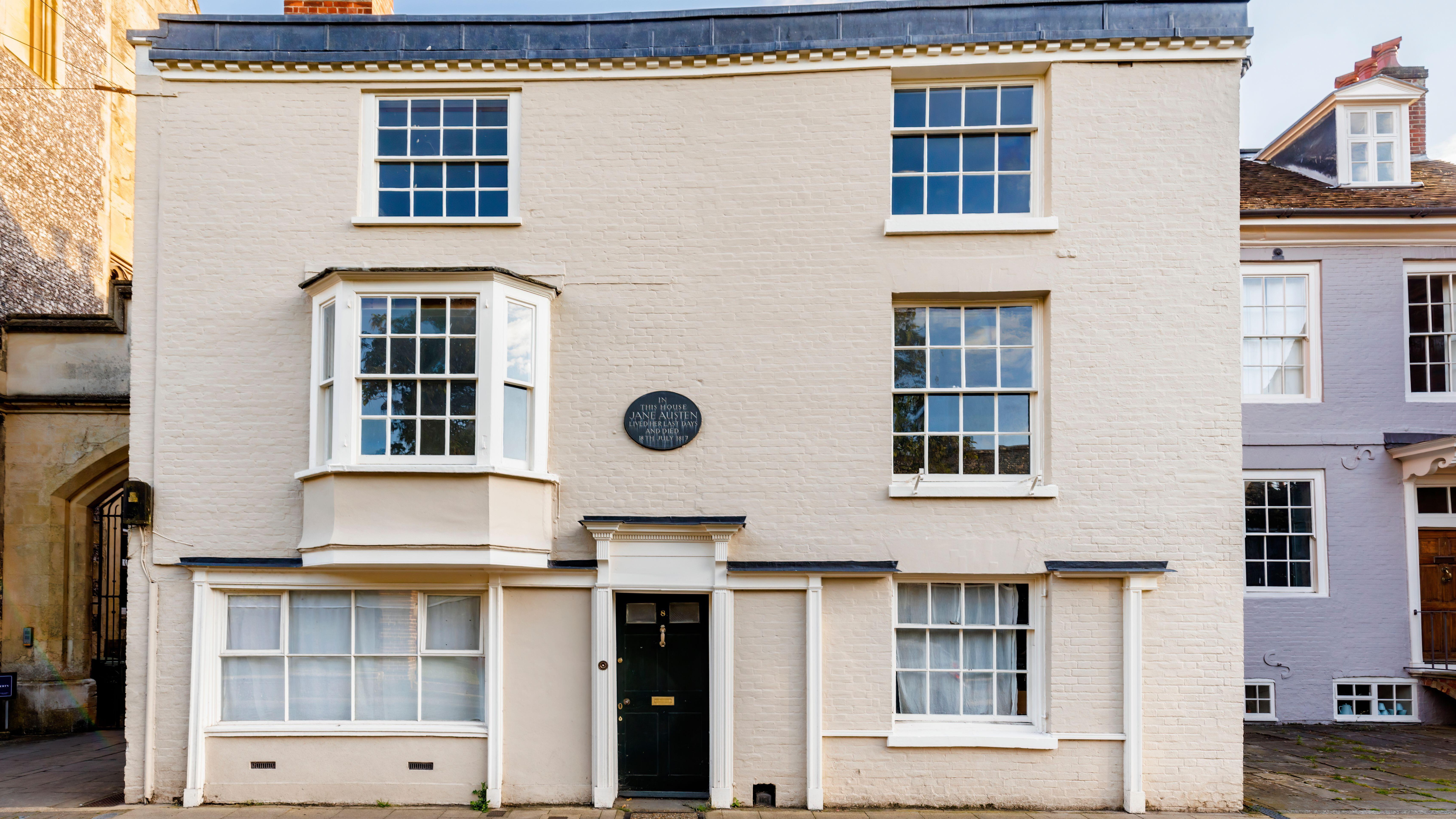 White brick house with white sash windows 