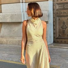 A woman on holiday with a swept bob hairstyle