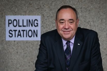 STRICHEN, SCOTLAND - SEPTEMBER 18:First Minister Alex Salmond stops for photographers as he casts his vote in the referendum on September 18, 2014 in Strichen, Scotland. After many months of 