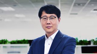 A head and shoulders photo of Damon Lee, CEO of Epsilon Telecommunications, looking at the camera