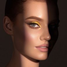 Beautiful woman with yellow cut crease eyeshadow