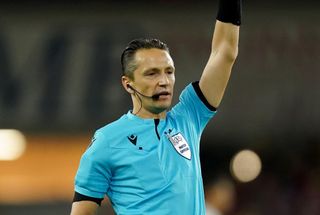 Slovenian referee Nejc Kajtazovic signals during the Nations League match between Wales and Poland at the Cardiff City Stadium, September 2022.
