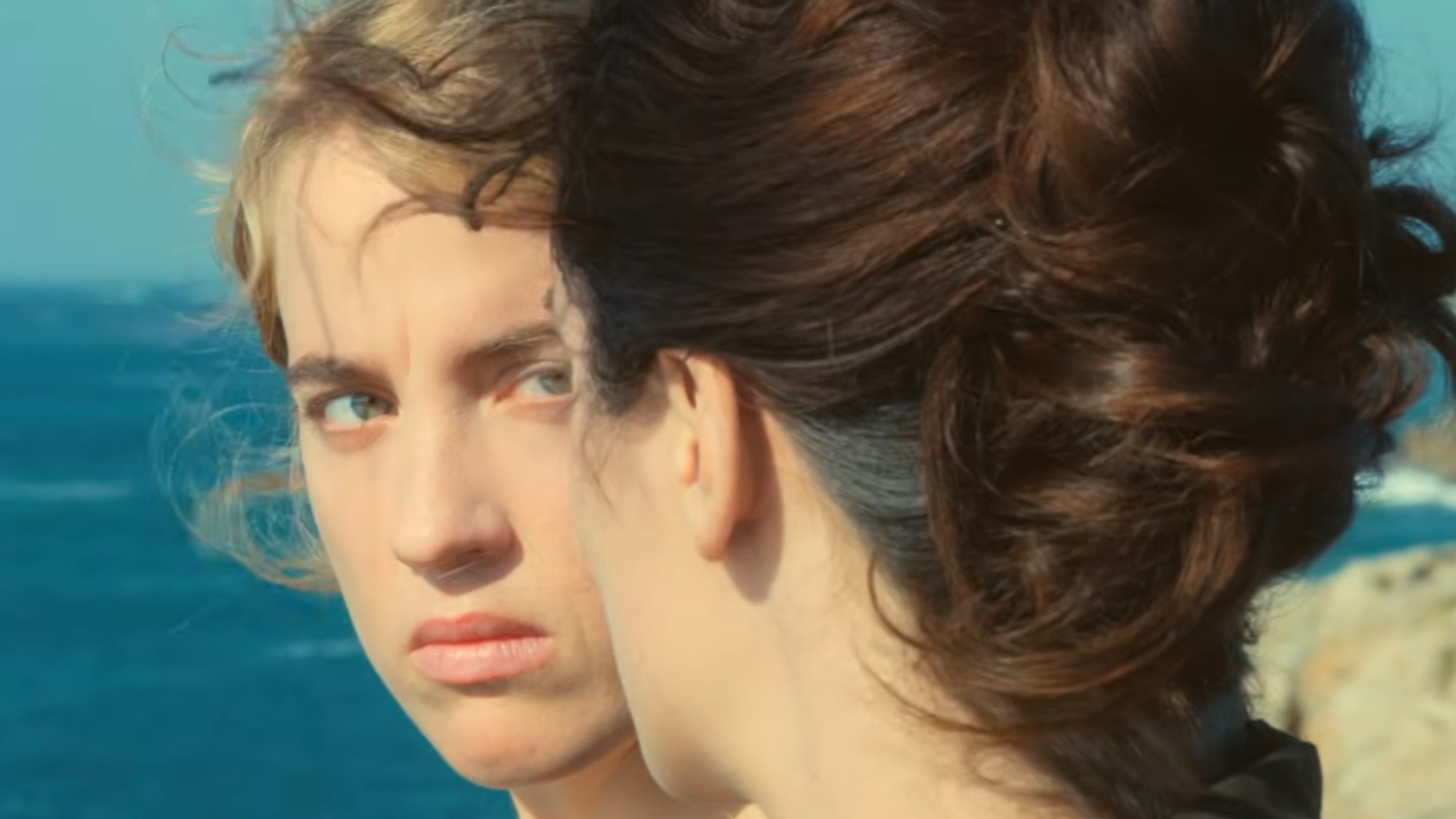 Ad&amp;egrave;le Haenel staring at No&amp;eacute;mie Merlant in Portrait of a Lady on Fire