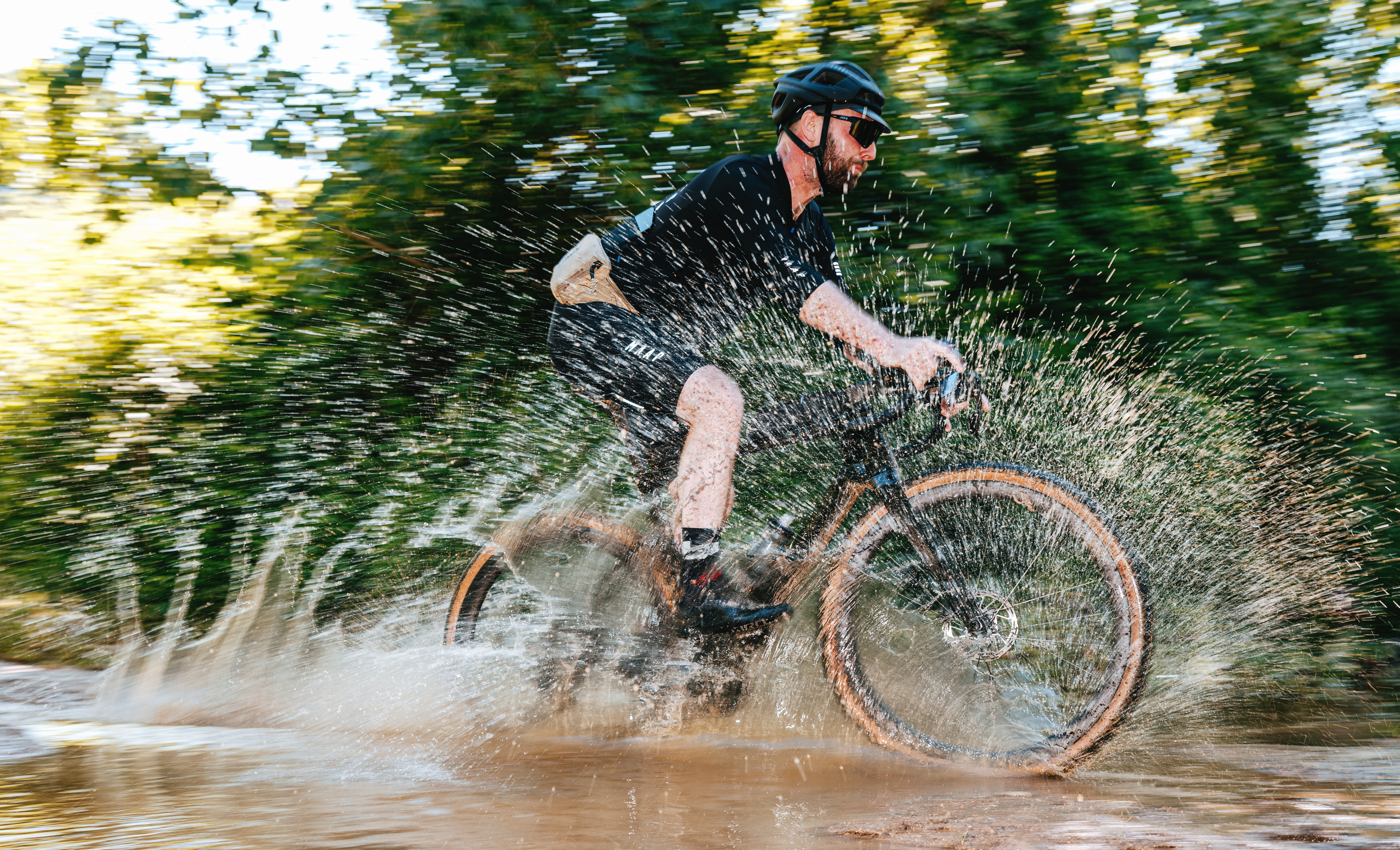 gravel bike riding through stream