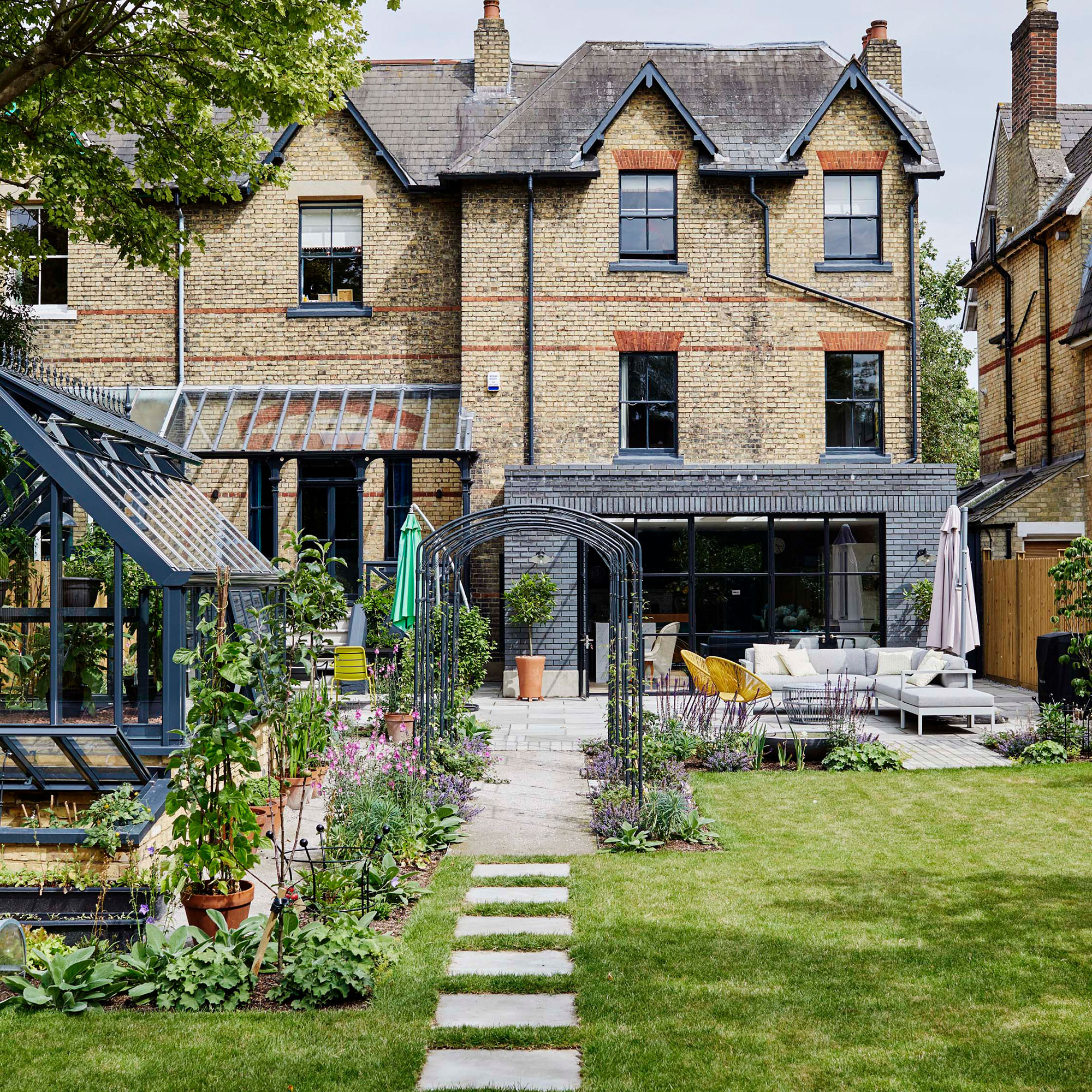 house exterior with garden and sofa