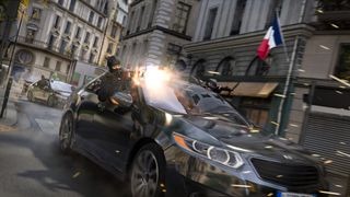 An armed figure leans from a black sedan as a bright muzzle flash erupts on a city street; a French flag hangs above the tense scene.