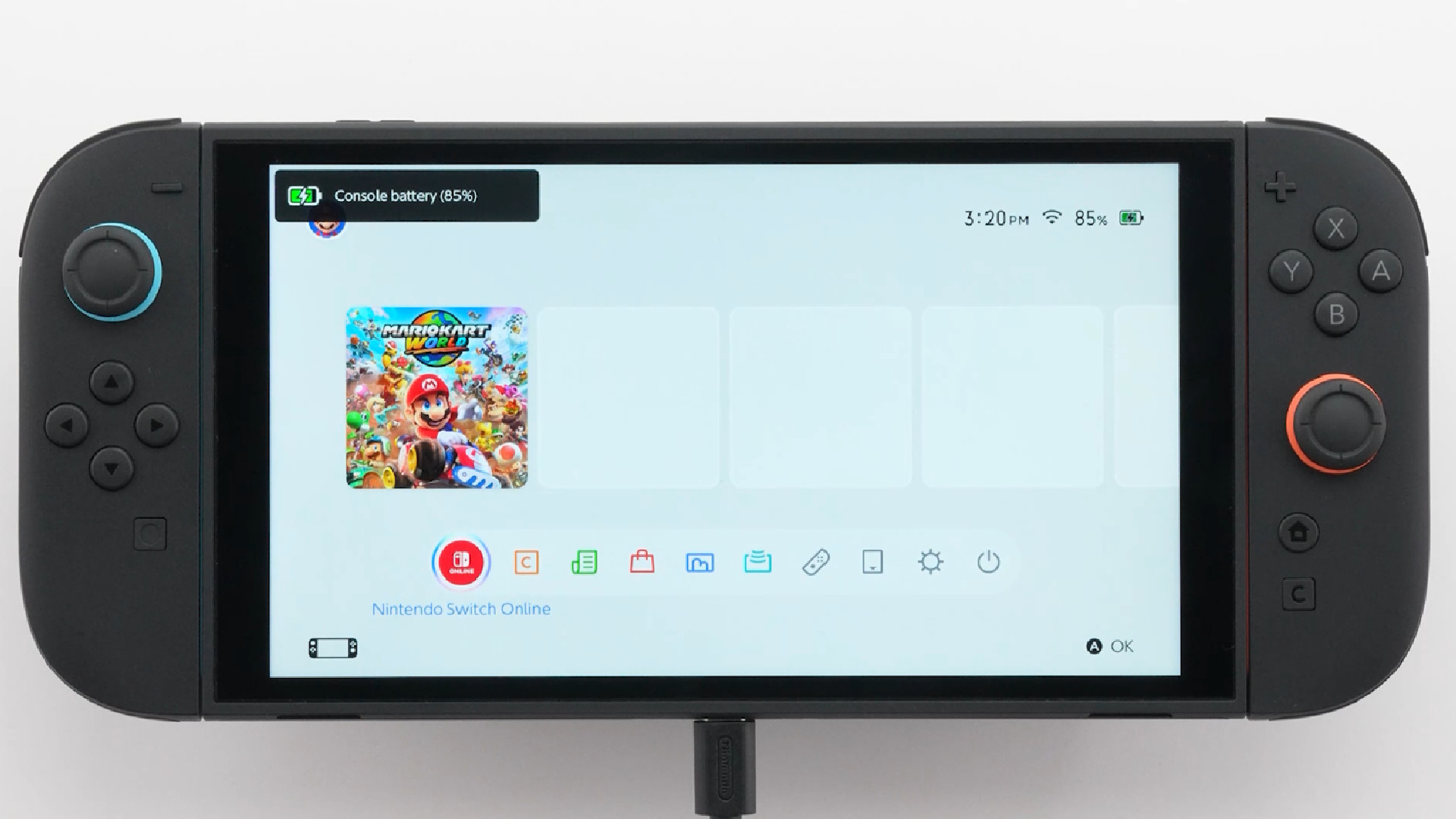 A Switch 2 console plugged in for charging
