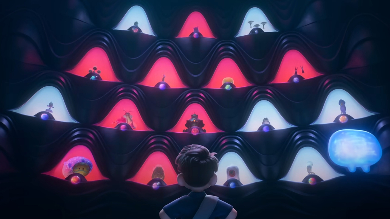 Screenshot from the animated sci-fi movie Elio. A young boy with a blue eye patch stands tall in the center of a giant auditorium as many different aliens stare down at him.