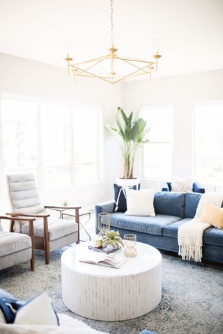 small living room lighting ideas with brass chandelier by Living with Lolo