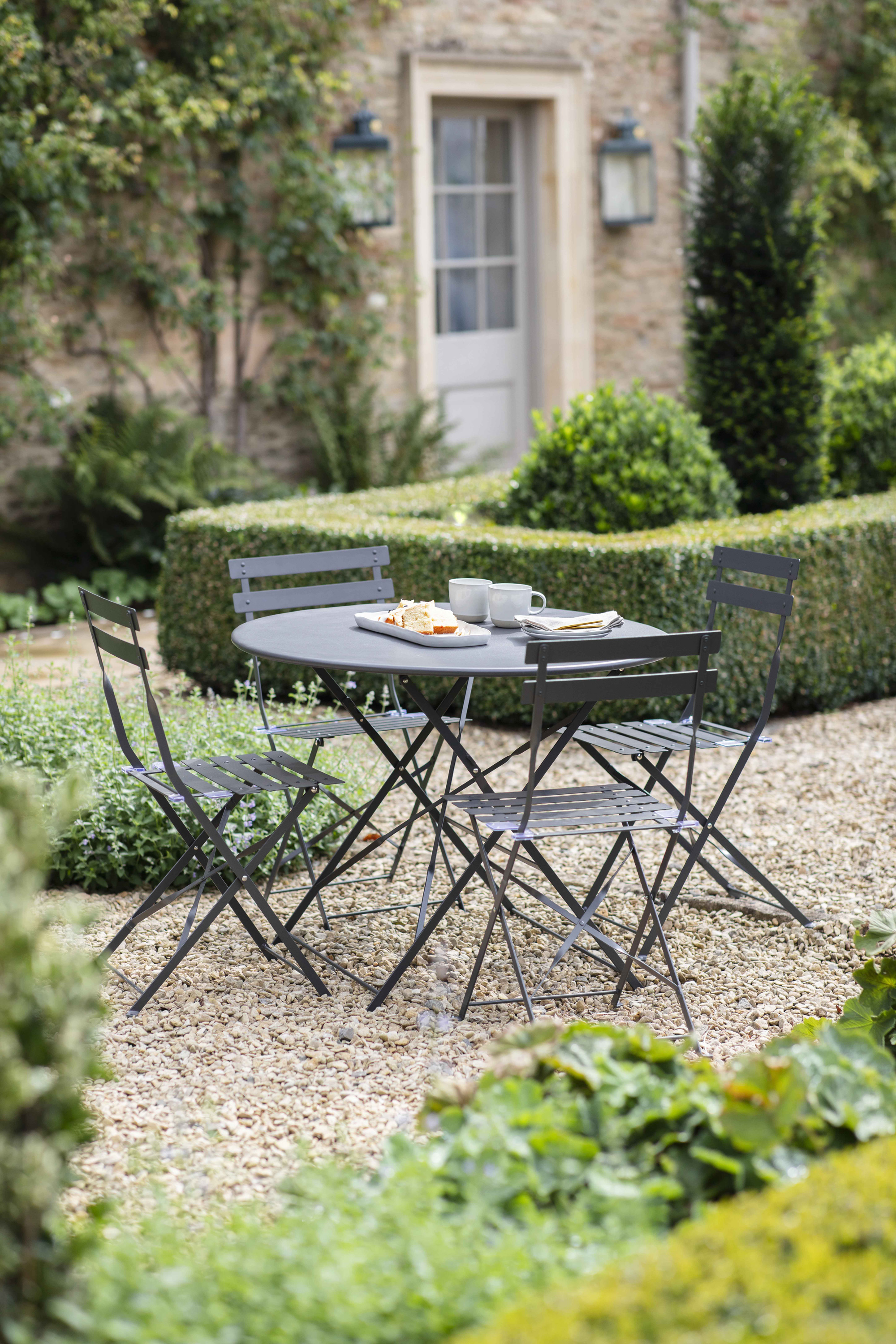 Garden Trading bistro set in a traditional garden