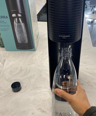 Christina Chrysostomou installing carbonating bottle into Sodastream Terra