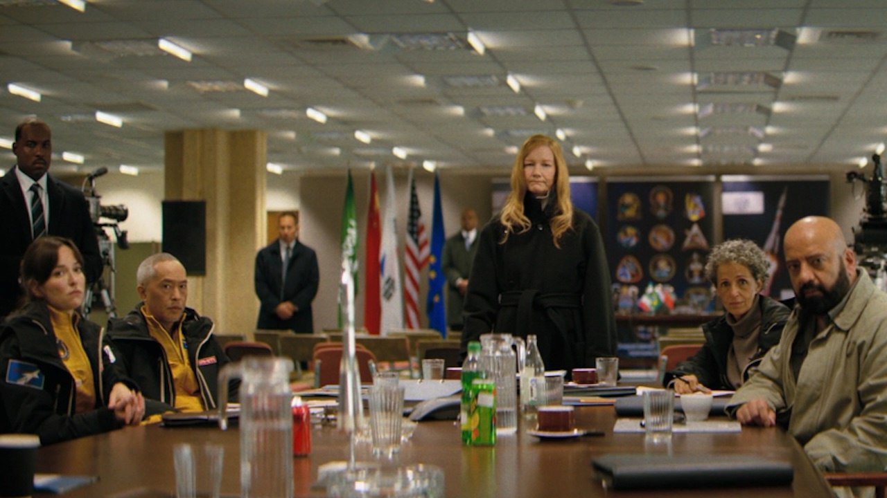 Sandra Huller and other cast members at a table in Project Hail Mary