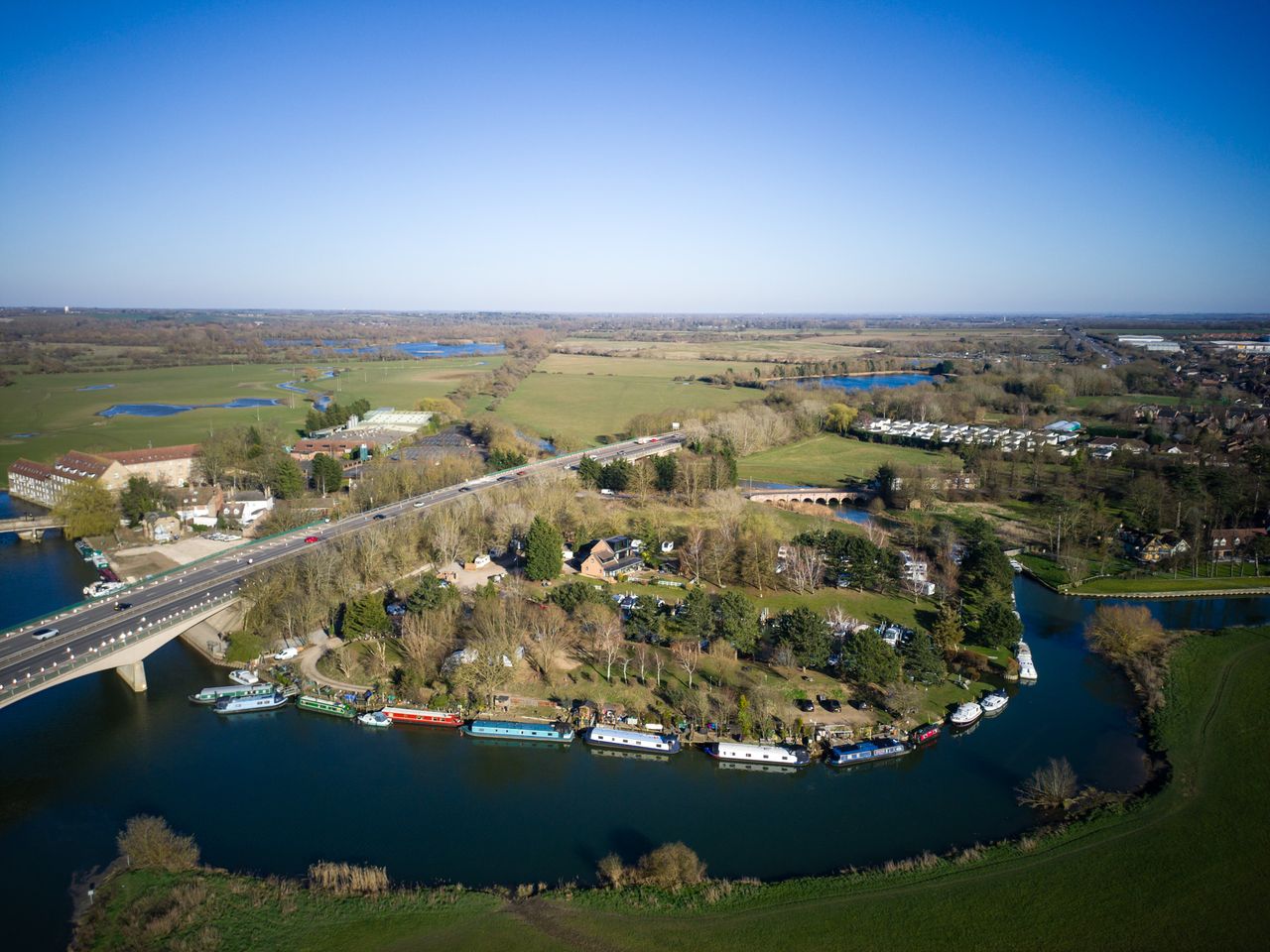 Photo of a river with moored boats taken with the Potensic Atom 2 drone