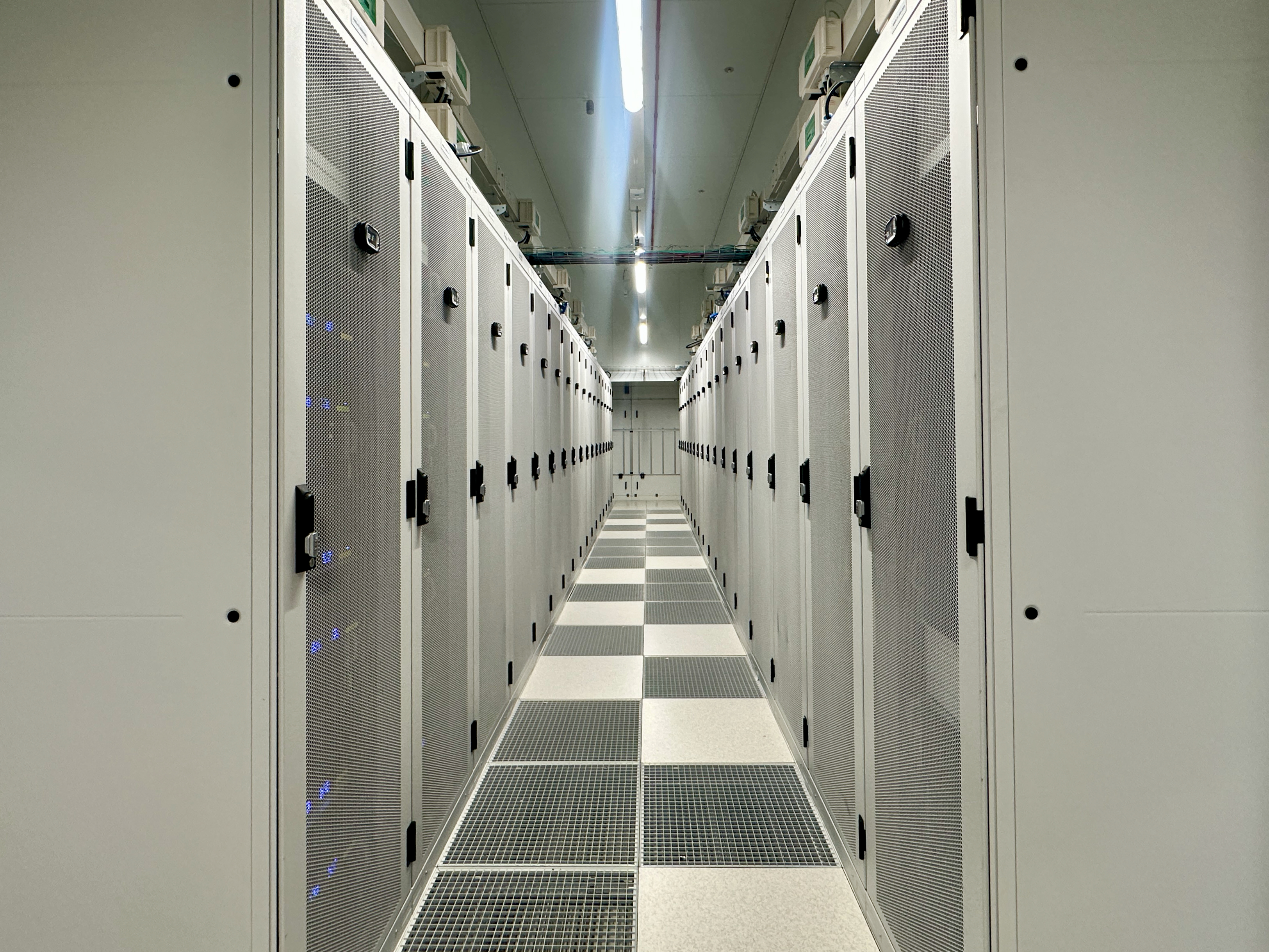 The view down the cool aisle in a data center