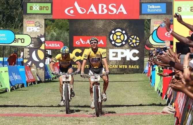 Karl Platt and Urs Huber of the Bulls cross the line without realizing they had won the stage