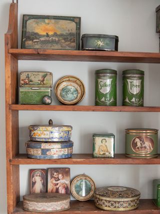 vintage-tins-on-wooden-shelf
