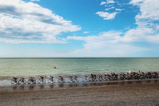 The peloton rides along the North Sea during stage 2 of the 2015 Tour de France.