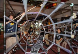 Volunteers assisted the artist Eric Lennartson in constructing Tape Wormhole (pictured) and Tape Gemini in just three days. The bones of the structures were flexible plastic wrap.