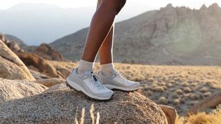 A hiker's feet wearing the Danner N45 hiking shoes