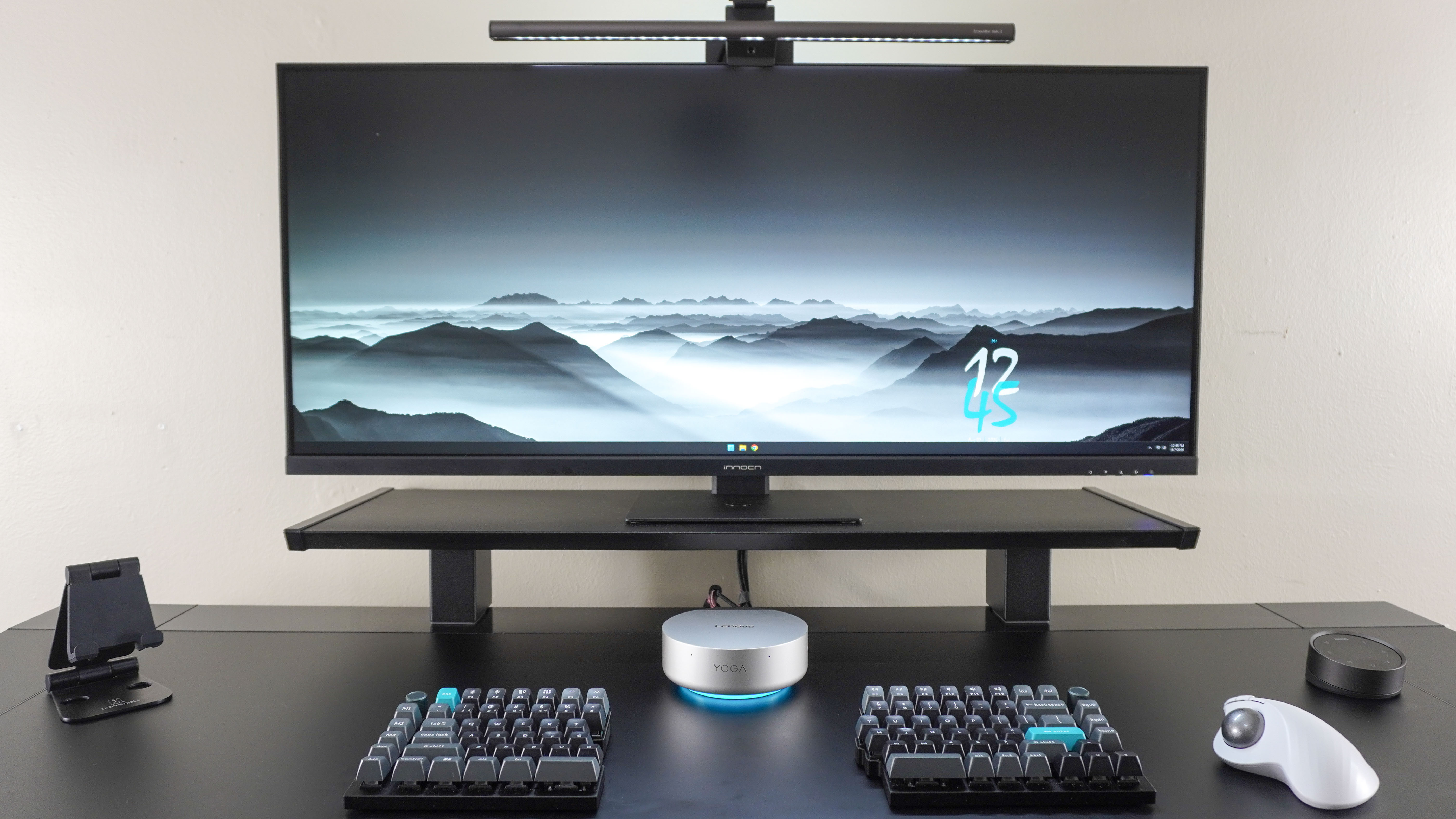 A desk setup built around the Lenovo Yoga Mini mini PC
