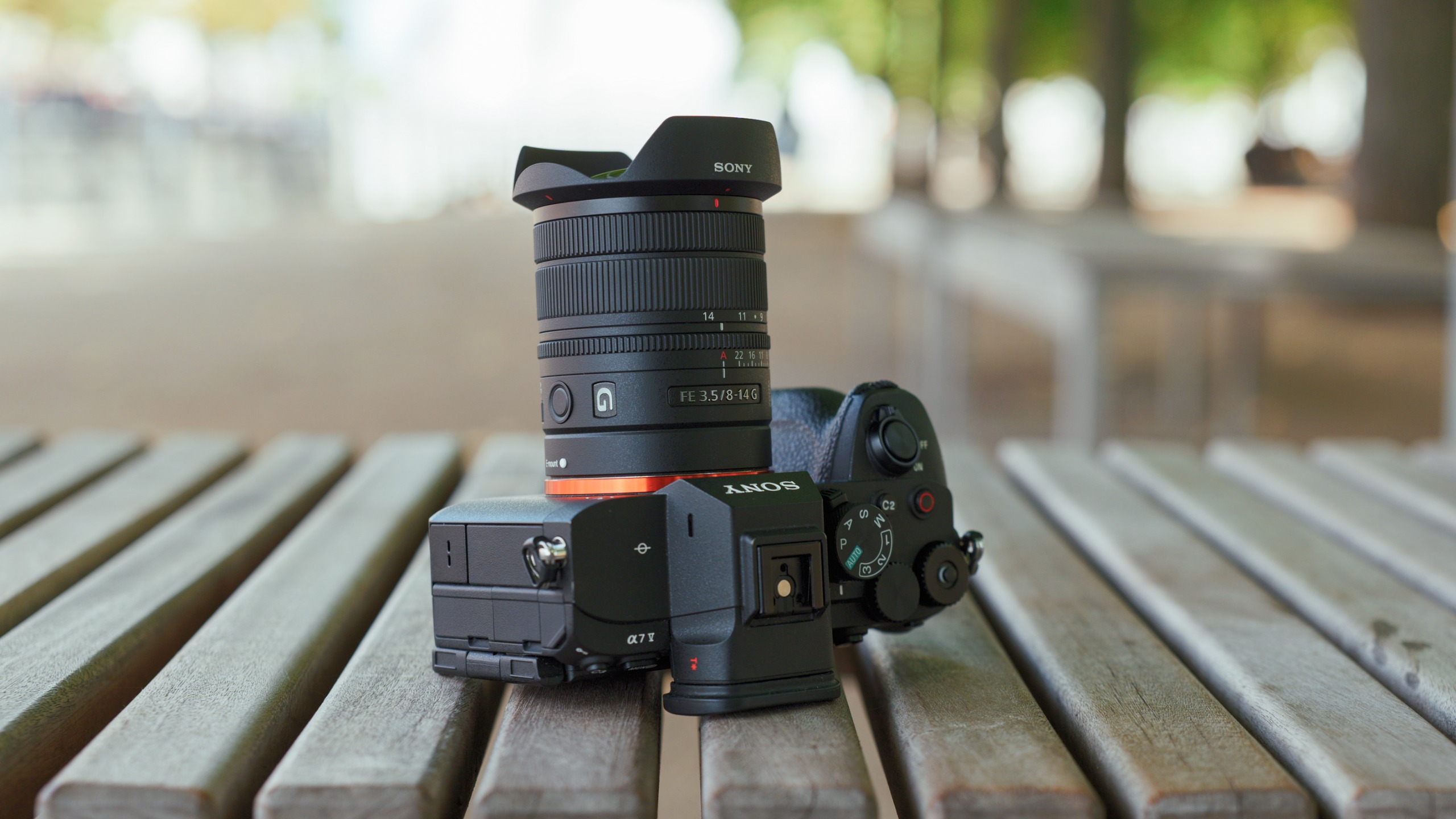 Rear three-quarter view of the Sony FE 8-14mm F3.5 G lens mounted on a Sony Alpha mirrorless camera.