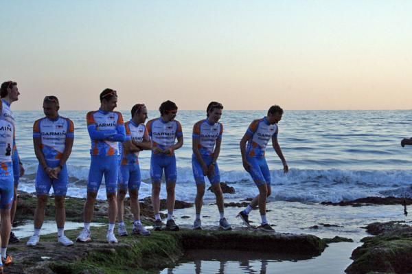 Garmin - Transition riders assemble on the beach for a team photo shoot.