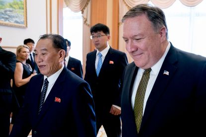 Secretary of State Mike Pompeo (R) and Kim Yong Chol (L), a North Korean senior ruling party official and former intelligence chief, arrive for a lunch at the Park Hwa Guest House in Pyongyan