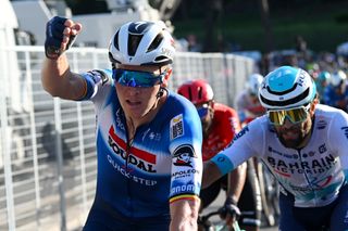 Tim Merlier celebrates his win on stage 21 of the Giro d'Italia