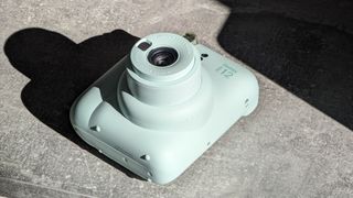 Fujifilm Instax Mini 12 instant camera in green