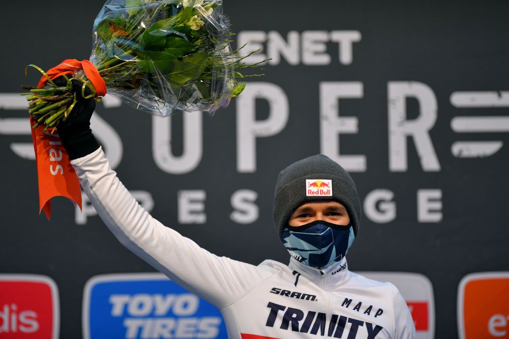 ANTWERPEN BELGIUM DECEMBER 13 Podium Thomas Pidcock of United Kingdom Team Trinity Racing Celebration Mask Covid safety measures Flowers during the 43rd Superprestige Cyclocross Gavere 2020 Men Elite Superprestige2021 SPGavere SuperprestigeCX on December 13 2020 in Antwerpen Belgium Photo by Luc ClaessenGetty Images