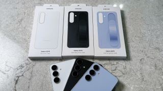 All colors of the Samsung Galaxy S25 FE and its official first-party cases on a light gray marble table.