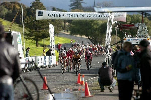 The race heads beneath the banner as riders go on the attack in the hope of escaping the peloton's clutches.