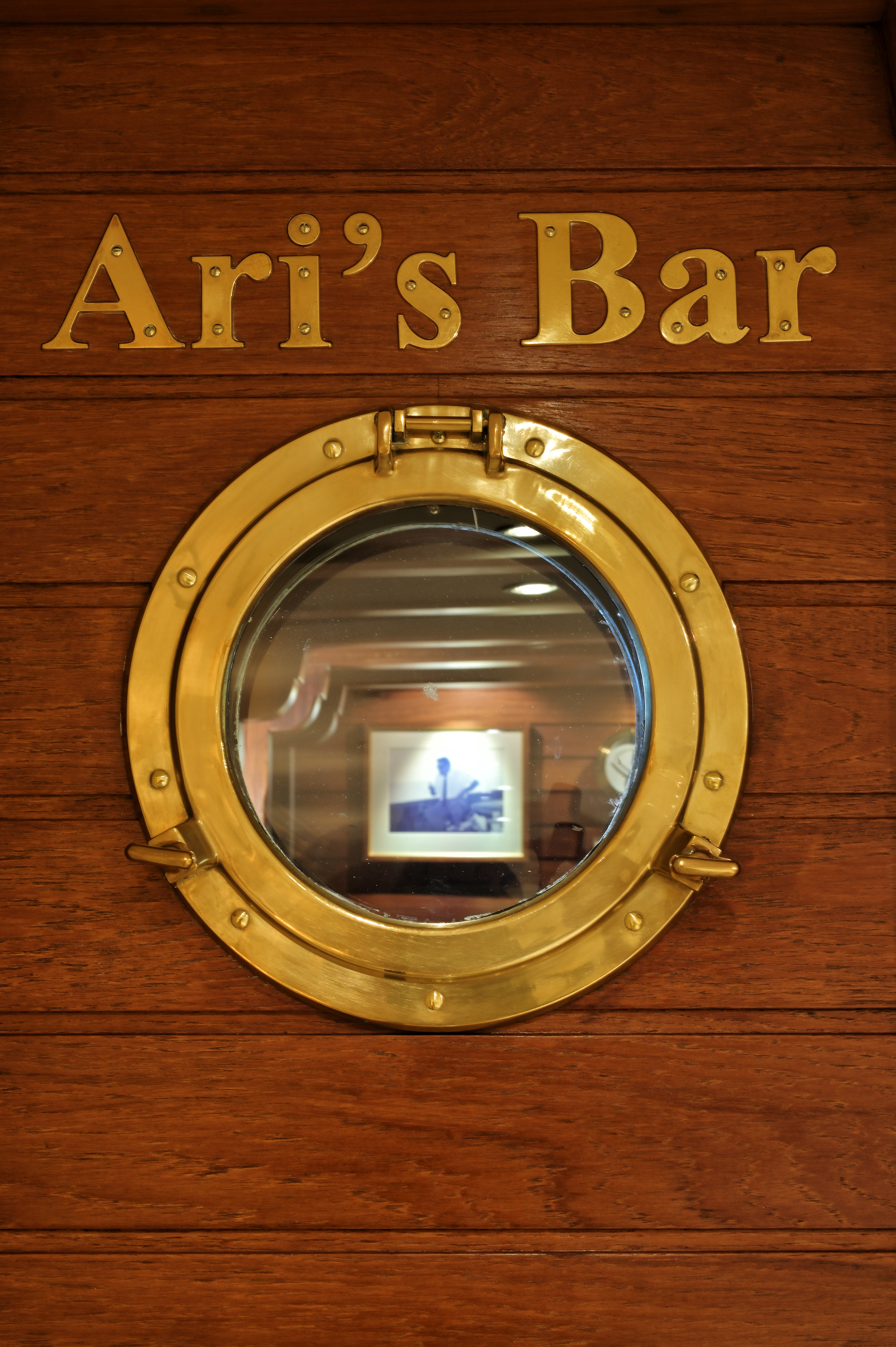 Close up of Ari's Bar door, which has a porthole