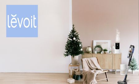 Levoit logo top left with a picture of a living room with a christma tree and appliances