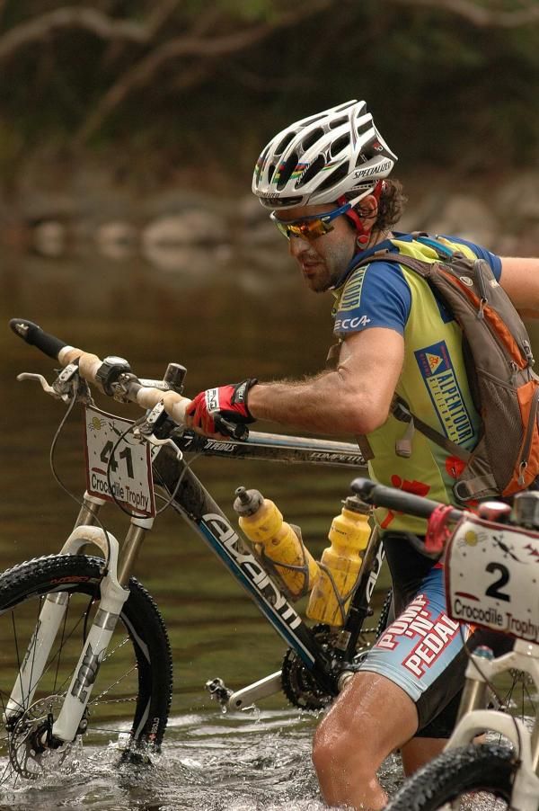 Isaac Tonello keeping his bike dry