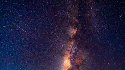 A meteor passes over the Milky Way in May 2023