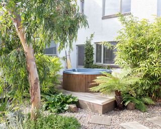 landscaped garden with gravel and hot tub