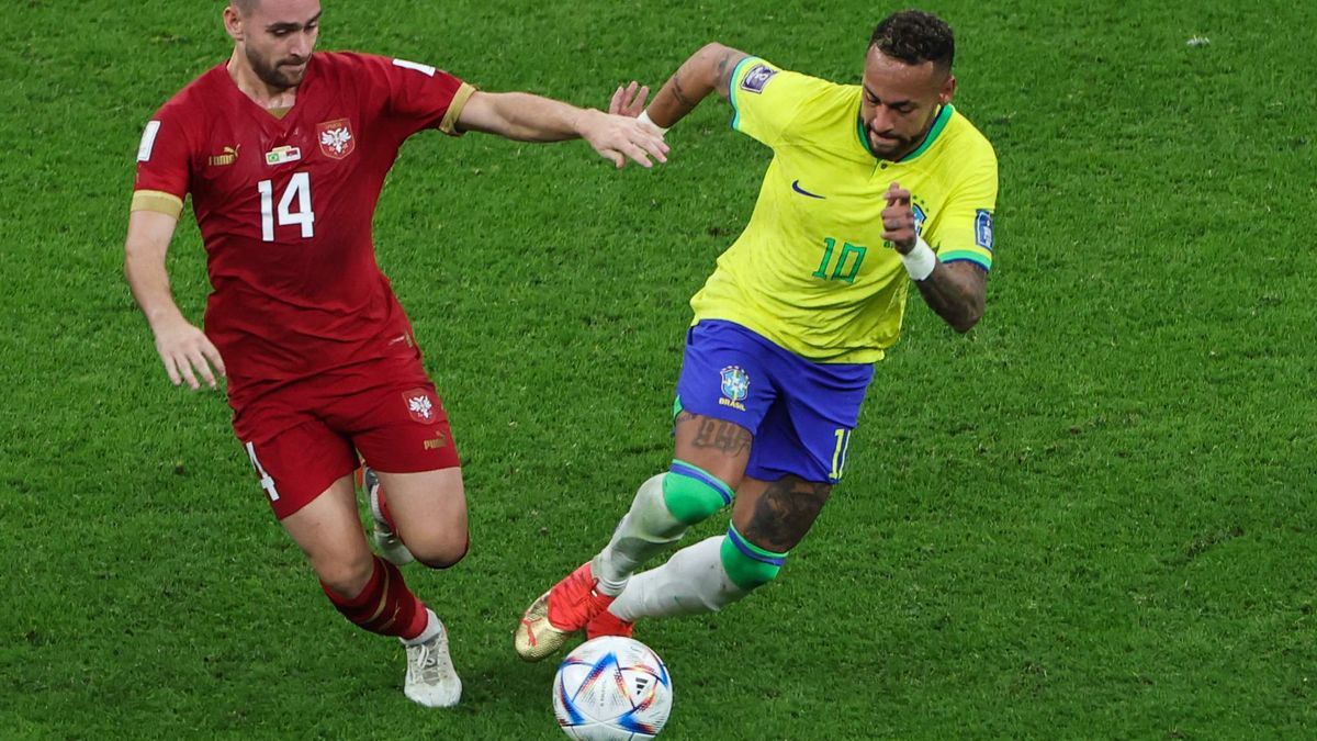 Brazil&#039;s Neymar tackling in a game against Serbia