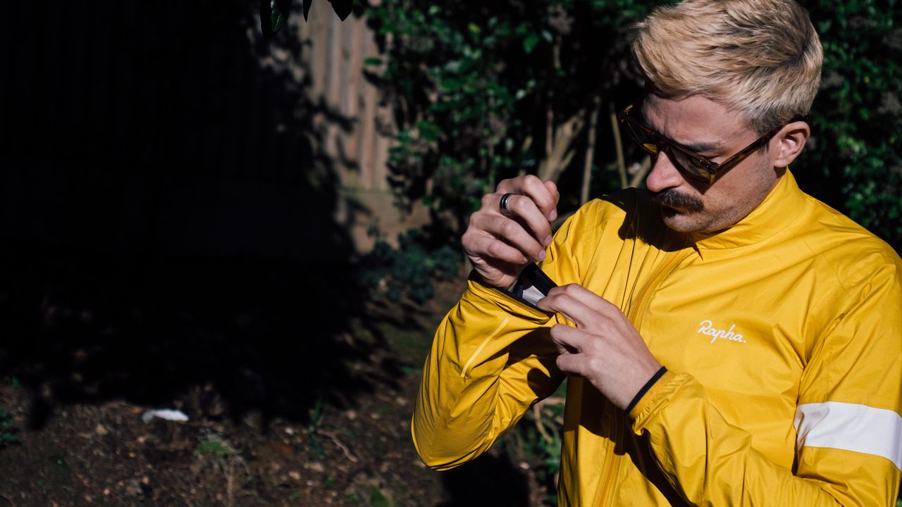 A yellow rapha core waterproof jacket