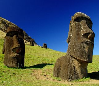 Easter Island &quot;heads&quot; on the slope of Rano Raraku volcano.