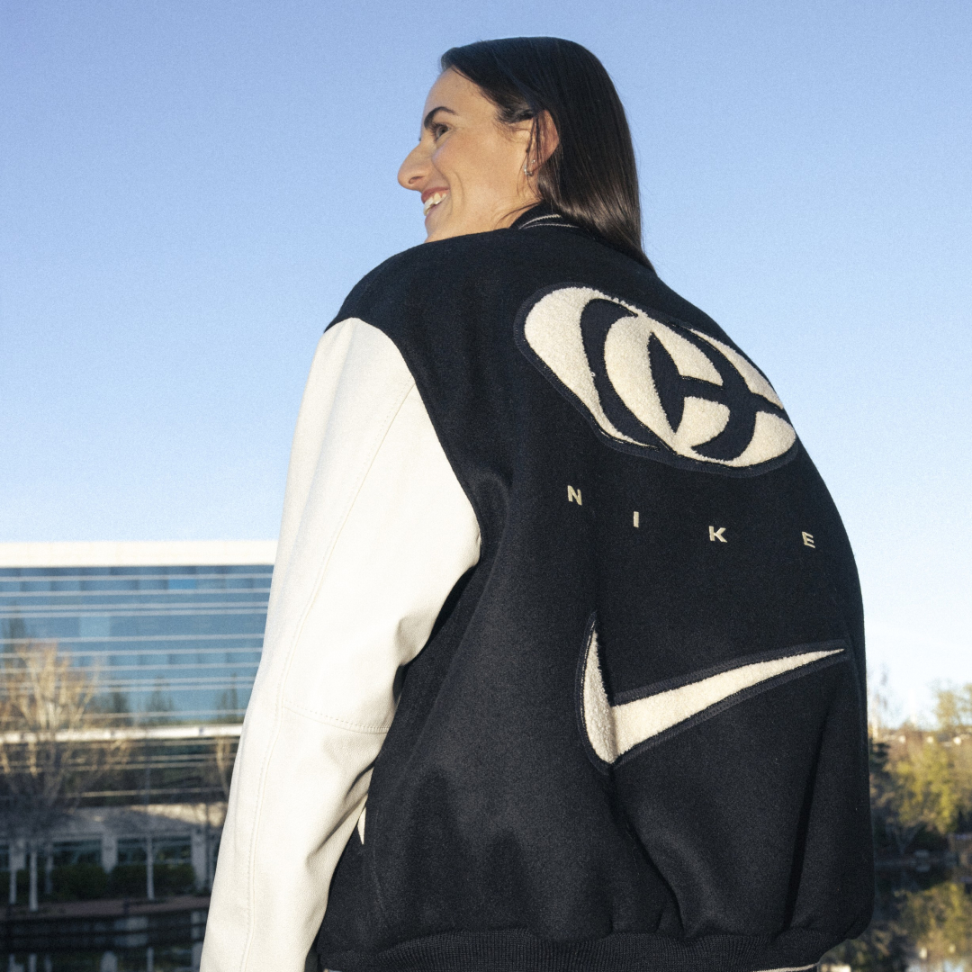 Caitlin Clark modeling a jacket from her collaboration with Nike.